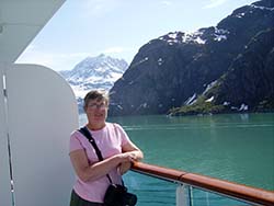 Marilyn, at the balcony, enjoying Glacier Bay