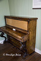 Old piano inside the train station museum, Prince Rupert, BC