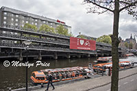 Canal boats and a bicycle parking garage near Centraal Station, Amsterdam, Netherlands