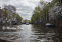 View up a side canal seen on the canal cruise, Amsterdam, Netherlands