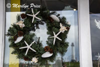 Wreath in a store window, Long Beach, CA