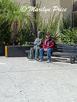 Charlie Chaplin and Carl on a bench, Roosevelt Hotel, Los Angeles, CA