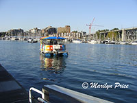 Aquabus pulling away from the Hornby Street Landing, Vancouver, BC, Canada