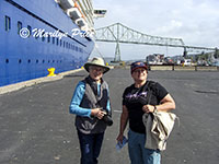 Marilyn and Kelly, our ship, and Astoria Bridge, Astoria, OR