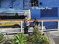 Marilyn and Kelly examine flowers, San Francisco, CA