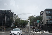 Looking up a street from the front of a cable car, San Francisco, CA