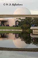 Spaceship Earth and monorail line reflected in a lagoon, EPCOT, Orlando, FL