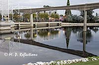 Monorail and Christmas tree reflected in a lagoon, EPCOT, Orlando, FL