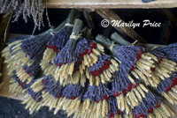 Bundles of dried lavender, roses, and wheat for sale at the market, L'isle sur la Sorque, France