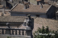 Statue seen near the top of the Palais des Papes, Avignon, France