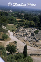 Roman ruins of Glanum with the newer village of St. Remy de Provence in the distance, near St. Remy de Provence, France