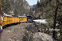 The train crosses a bridge and releases some excess steam, Durango-Silverton Narrow Gauge Railroad, Durango, CO