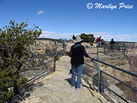 Marilyn ventures onto the top of Angel's Window, Cape Royal Trail, on Cape Royal road, Grand Canyon National Park, AZ