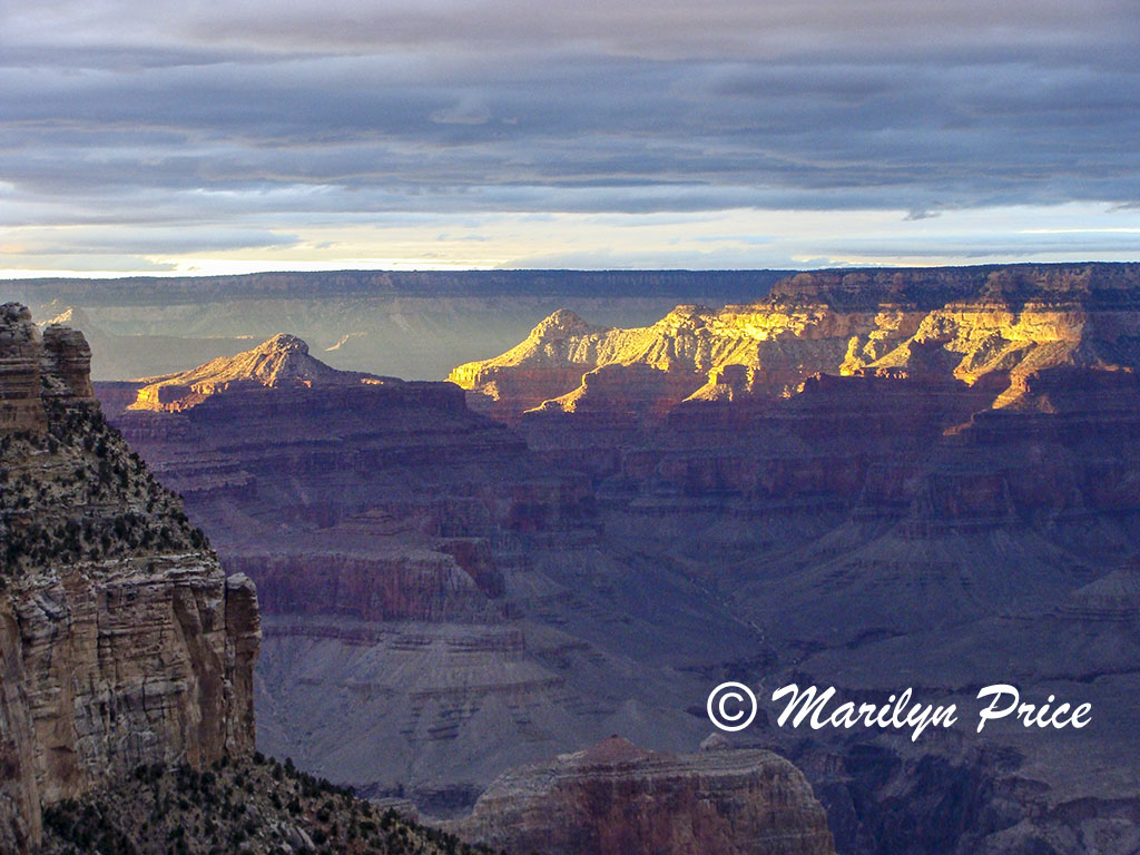 The sun breaks through the overcast, Village rim area, Grand Canyon National Park, AZ