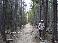 Marilyn and a dead snag, trail between Bierstadt Lake and Bear Lake, Rocky Mountain National Park, CO