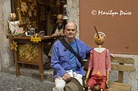 Carl and Pinnocchio, outside a toy store, Rome, Italy