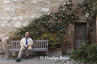 Carl enjoys another cup of coffee, courtyard, Il Rigo, Tuscany, Italy