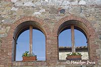 Upper windows of courtyard, Il Rigo, Tuscany, Italy