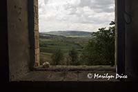 Countryside from window of abandoned farm house, Tuscany, Italy