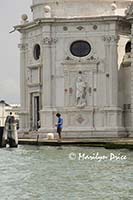 Fisherman in front of San Michele in Insola, Venice, Italy