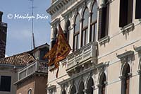 Venetian flag on a building, Venice, Italy