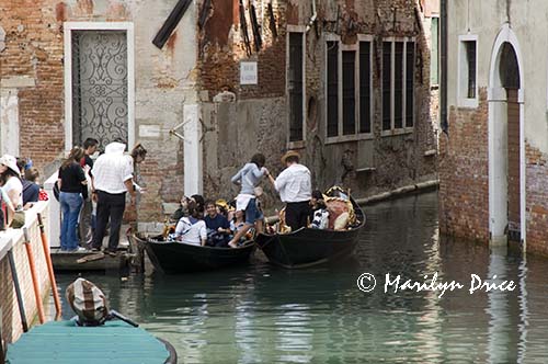 Loading a gondola, Venice, Italy