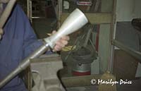 Hammering a finish onto a wine flask, Florence, Italy