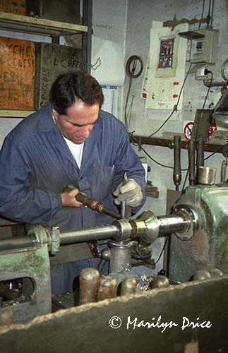 Silversmith fashioning a cup on a lathe, Florence, Italy