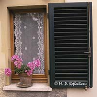 Window and lace curtain, Monteriggioni, Italy