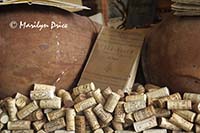 Old corks in window of wine shop, Greve in Chianti, Italy