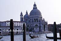 Gondolier and Santa Maria della Salute, Venice, Italy