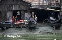 Men at work at a gondola repair shop, Venice, Italy