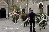 A funeral procession assembles, Burano, Italy