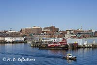 Fishing boat leaves harbor, Portland, ME