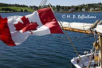 Canadian flag flying from the stern of the Bluenose II, Lunenburg, Nova Scotia