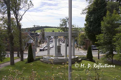 Looking towards the wharf from behind the war memorials in the park, Lunenburg, Nova Scotia