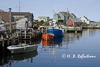 Fishing boats tied to a wharf, Peggy's Cove, Nova Scotia