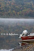 Motor boat and autumn colors, Nahmakanta Lake, ME