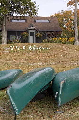 kayaks drying in front of the lodge at Nahmakanta Lake Camp, ME