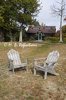 Adirondack chairs in front of the lodge at Nahmakanta Lake Camp, ME