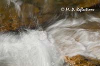 Water breaking over rocks