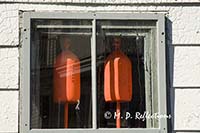 Lobster bouys in a window, Bass Harbor, ME