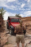 Jenny gives a helping hand to Carl, descending first hill, Elephant Hill jeep trail, Canyonlands National Park, UT