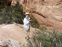 Marilyn shoots something near the Slot canyon, Joint Trail, Canyonlands National Park, UT