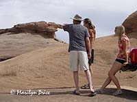 Jenny and Jim point to the trail ahead, near Moab, UT