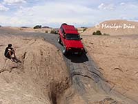 Jim takes his jeep through a 'hot tub', Hell's Revenge, near Moab, UT