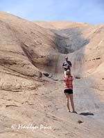 Jim and Jessi scout one of the obstacles on Hell's Revenge, near Moab, UT