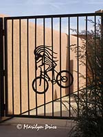 Kokopelli on a bicycle, gate at our condo, Moab, UT