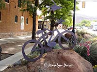 Kokopelli on a bicycle, statue on street, Moab, UT