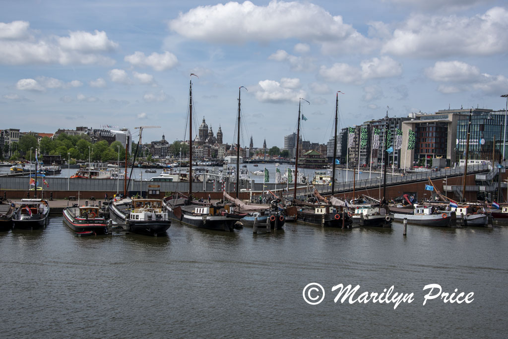View across the harbor towards the historic part of town from the deck of the replica trading vessel, Maritime Museum, Amsterdam, Netherlands